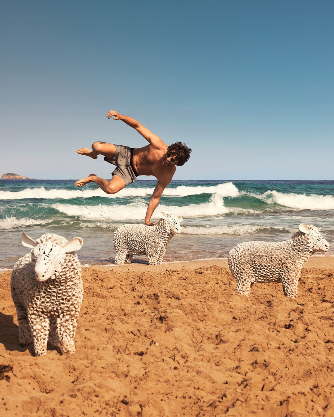 Man jumping over sheep